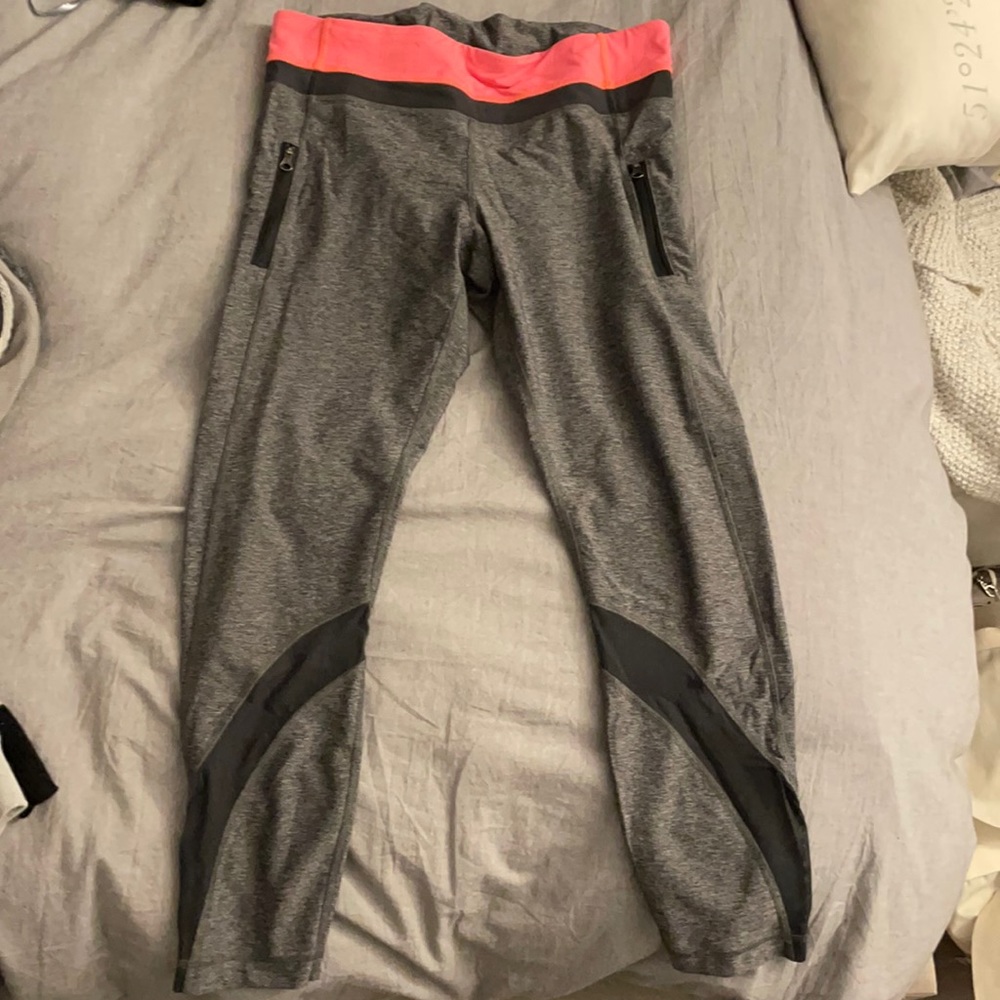 Grey/Salmon Lululemon workout mid calf leggings.